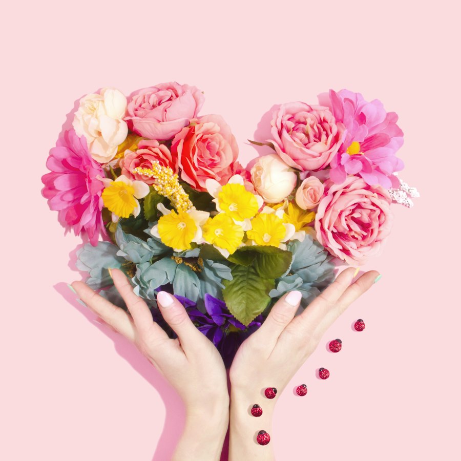 Florist hands arranging blooms in studio